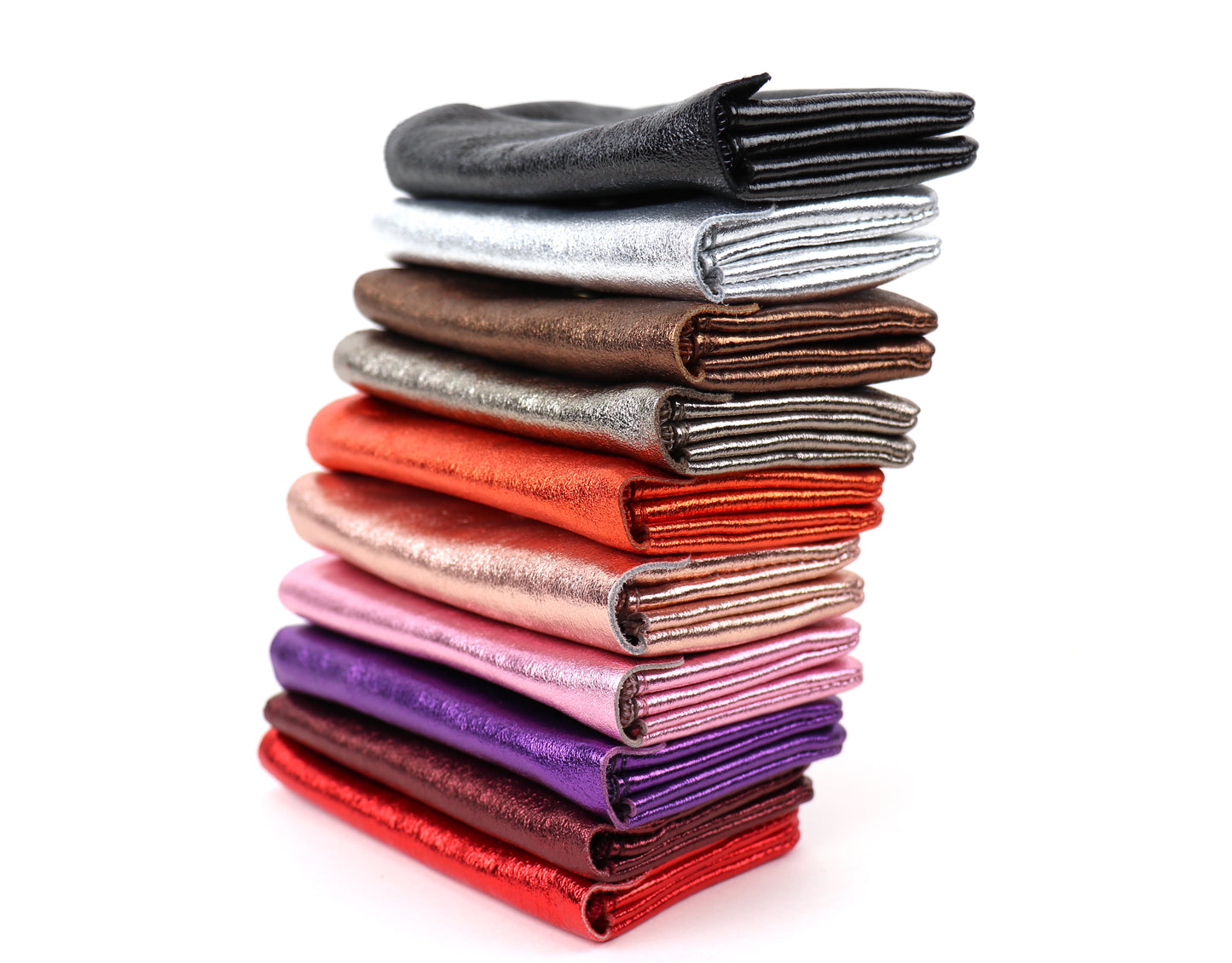 Side view of a stack of medium metallic pouches in different colors, showing their slim profiles and variety of shades.