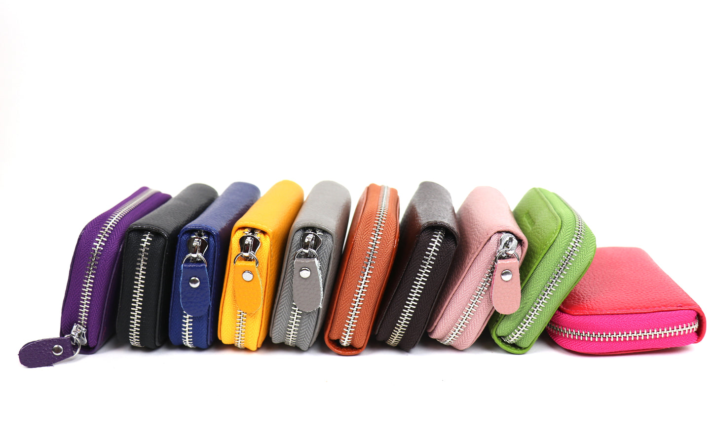 A collection of small leather card holder wallets in various colors, including purple, yellow, black, pink, green, orange, and more, arranged in a row.
