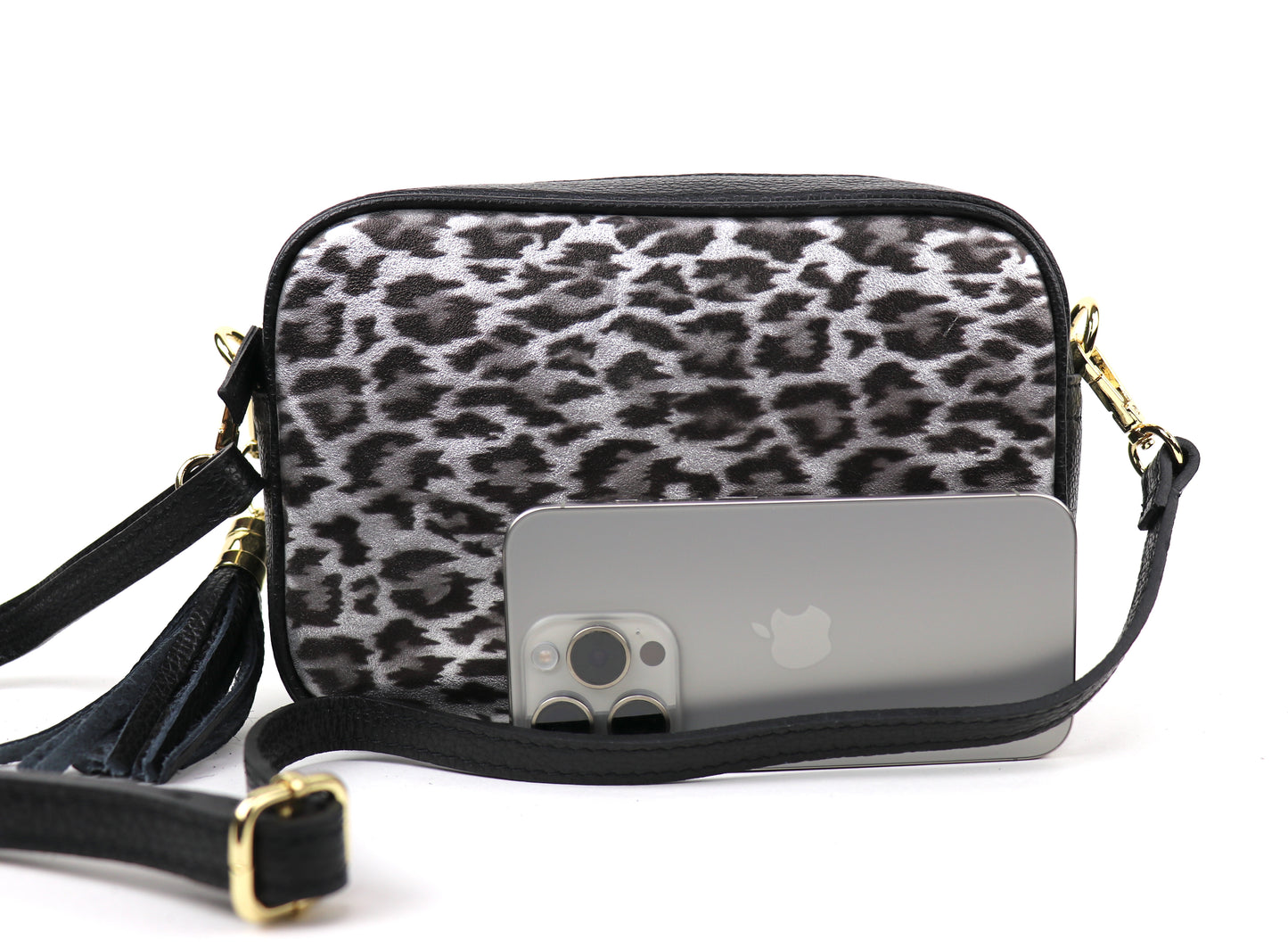 Silver Leopard print leather bag next to a smartphone, showing the bag's size relative to the phone.