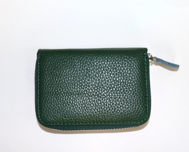 Back view of a small leather card holder wallet in dark green, showing the pebble-grain texture.