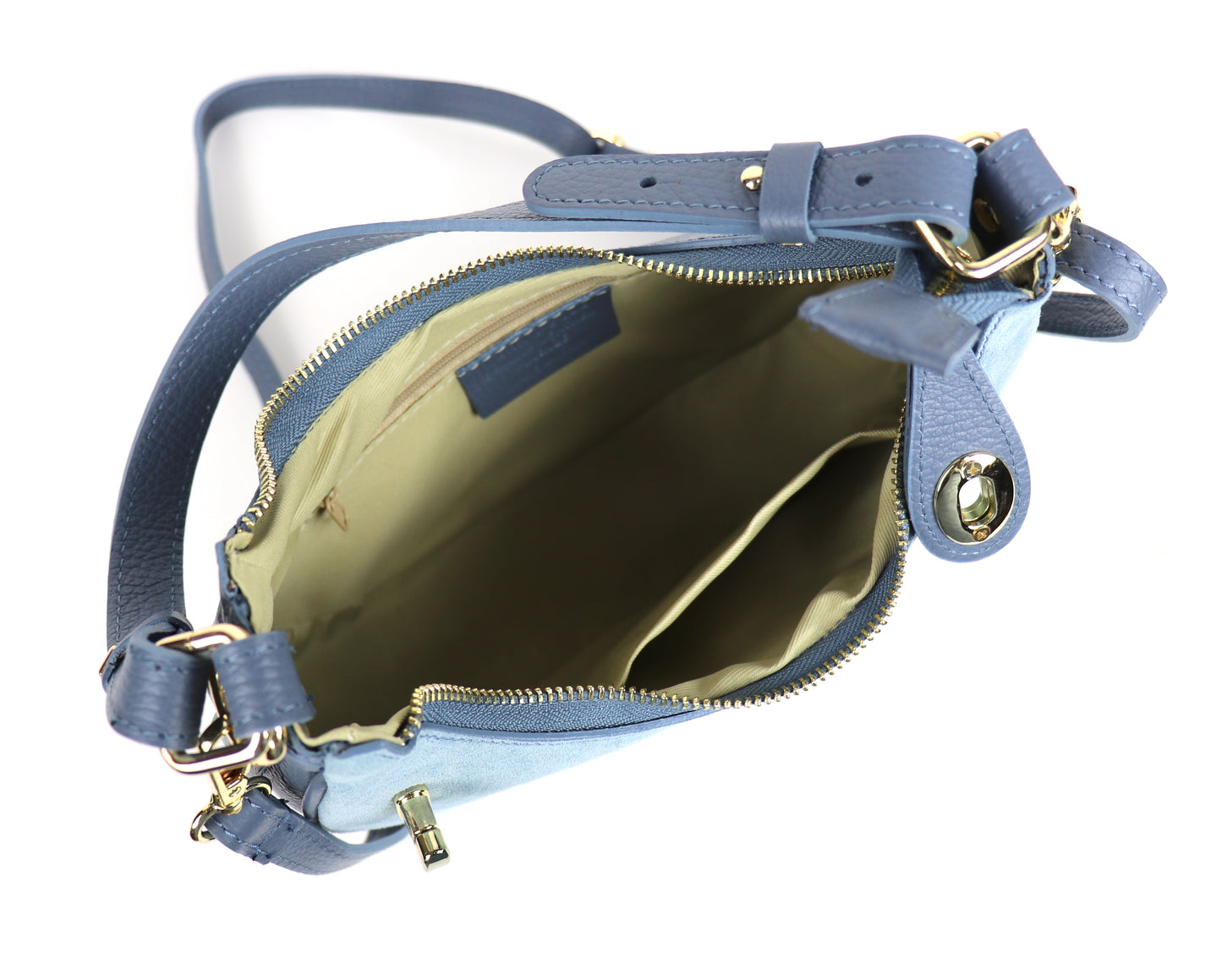 Open Denim Blue small half moon shoulder/crossbody bag, showing a detailed view of the interior with gold-tone hardware and beige lining. The zipper and inner pockets are visible, highlighting the bag's spacious organization.