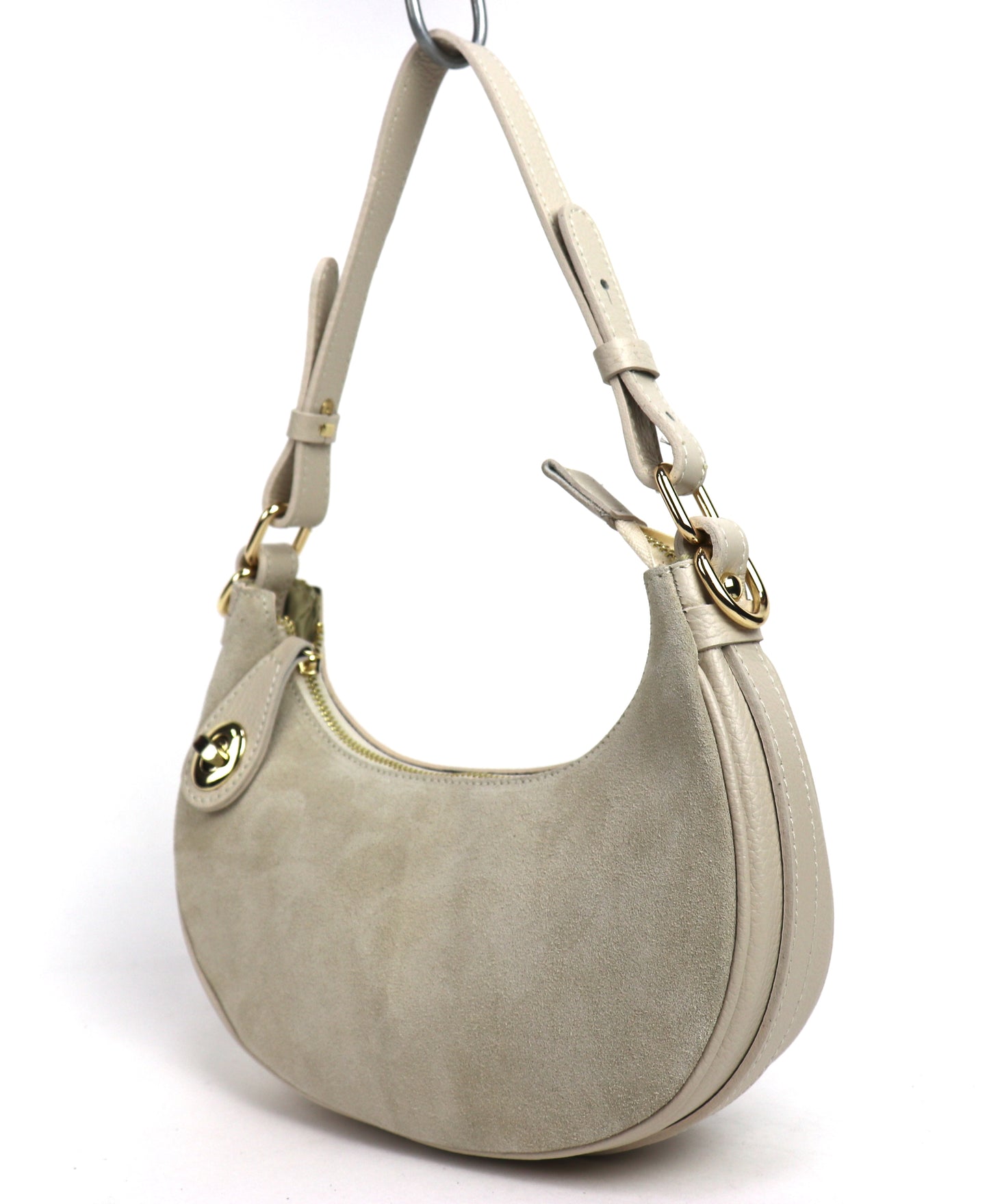Cream half moon bag angled front view.
