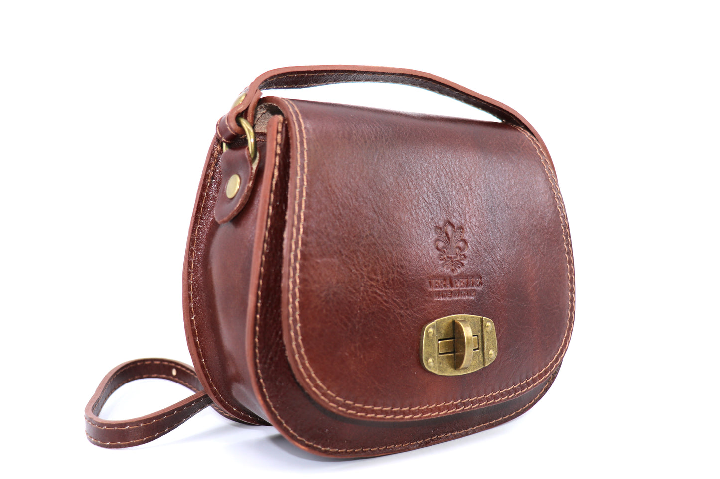 Side view of a dark tan Cora Vintage Small Leather Crossbody Bag, featuring smooth, rounded edges and a brass lock clasp, displayed on a white background.
