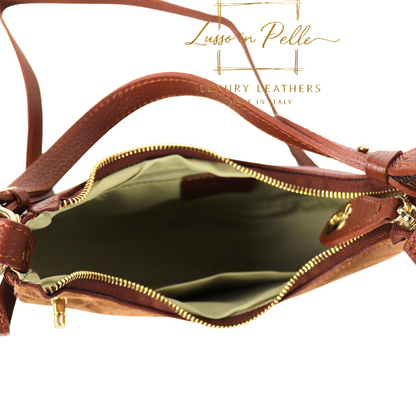 Brown leather handbag with gold interior on a white background, featuring the brand 'Lusso in Pelle'.