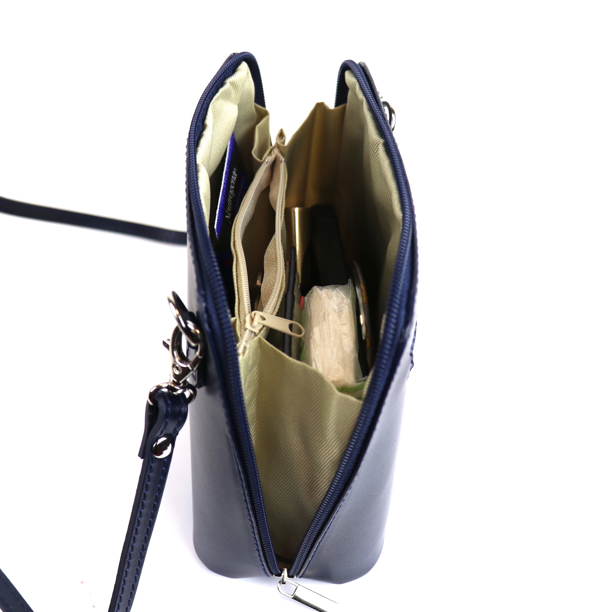 Navy Small Handmade Leather Crossbody Bag, top view highlighting the interior organization and sleek design.
