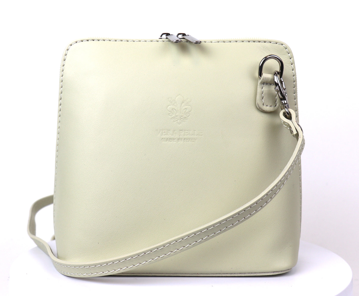 Cream Small Handmade Leather Crossbody Bag, front view with a soft cream color and structured shape.
