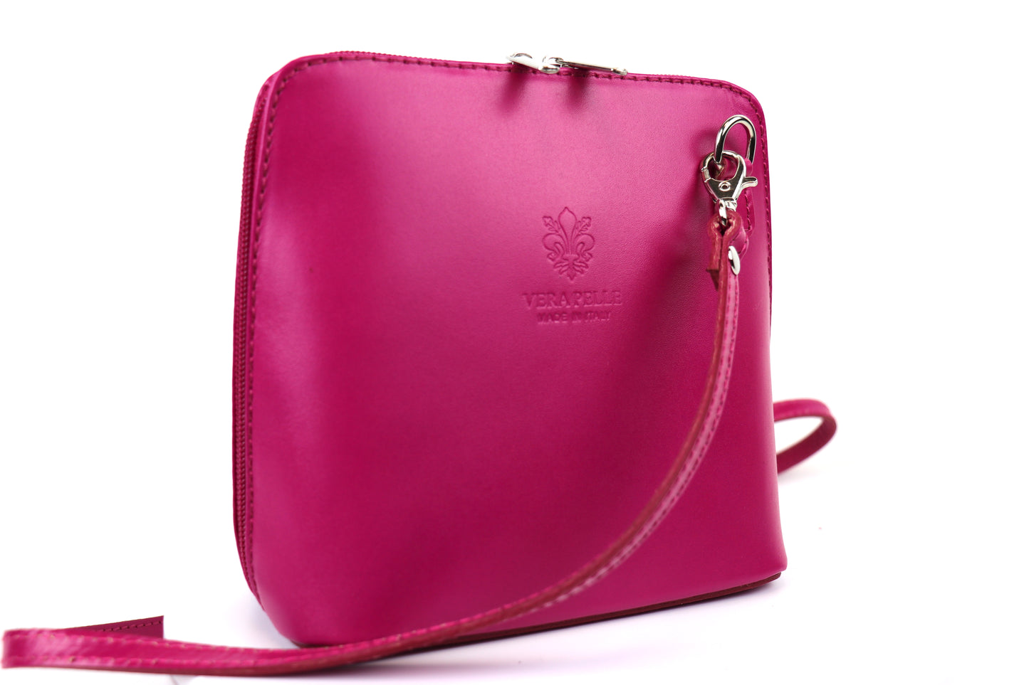 Fuchsia Small Handmade Leather Crossbody Bag, side view featuring a bright and bold pink.
