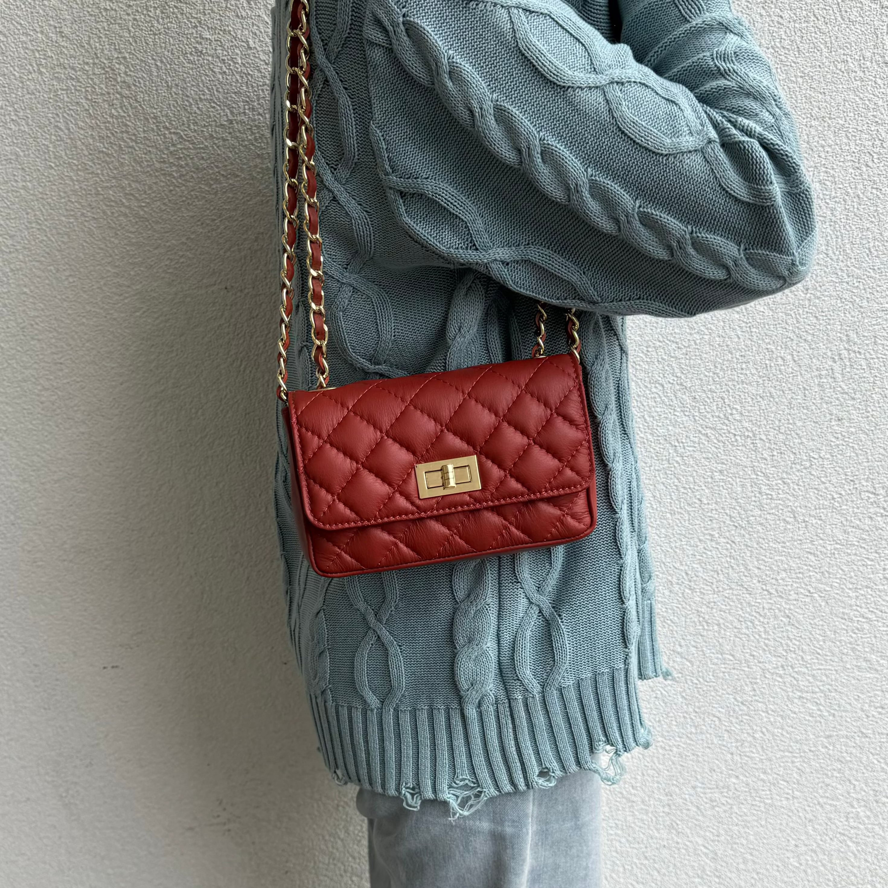 Model Wearing Red Quilted Bag