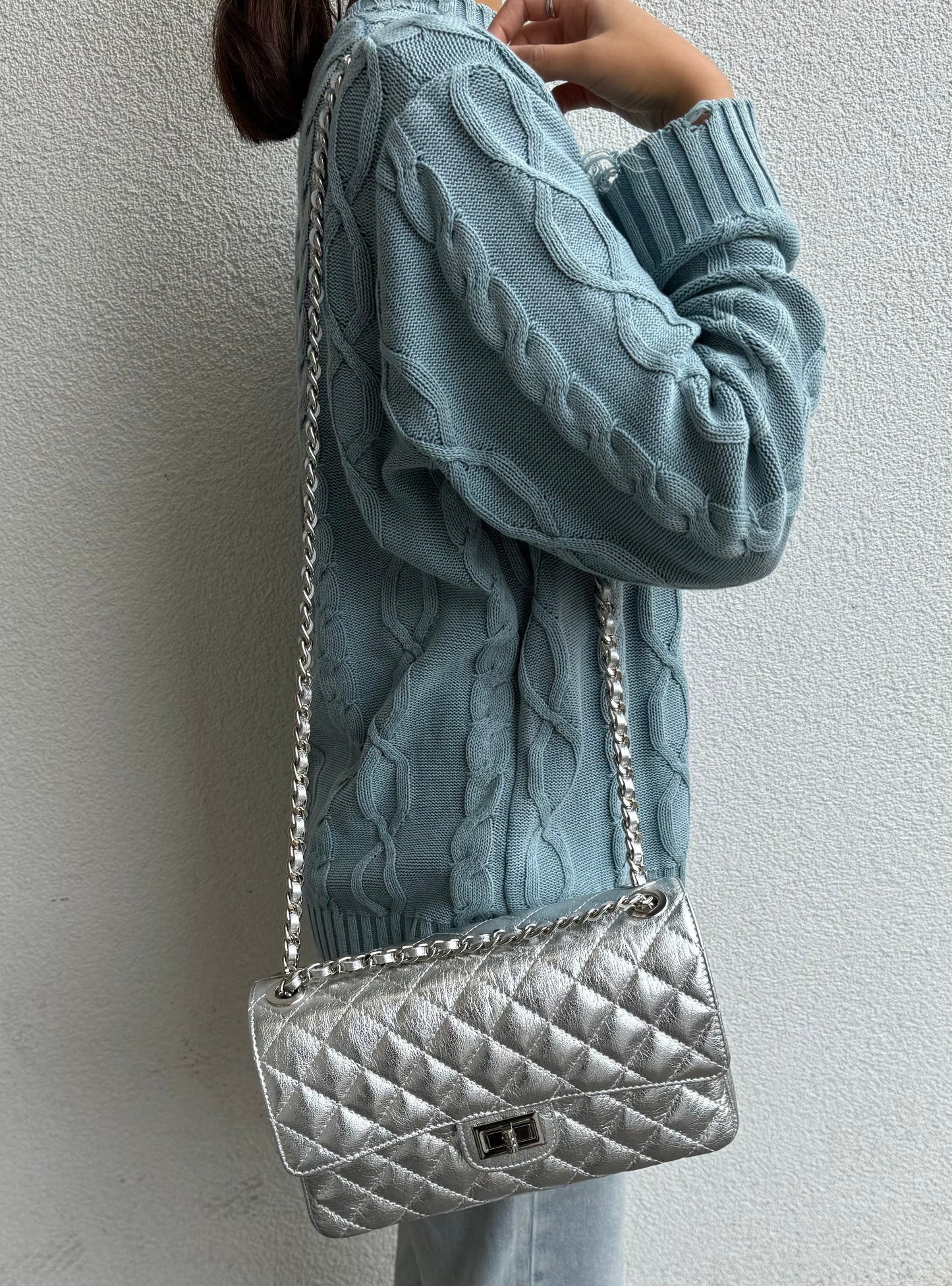 Model Wearing Silver Quilted Bag