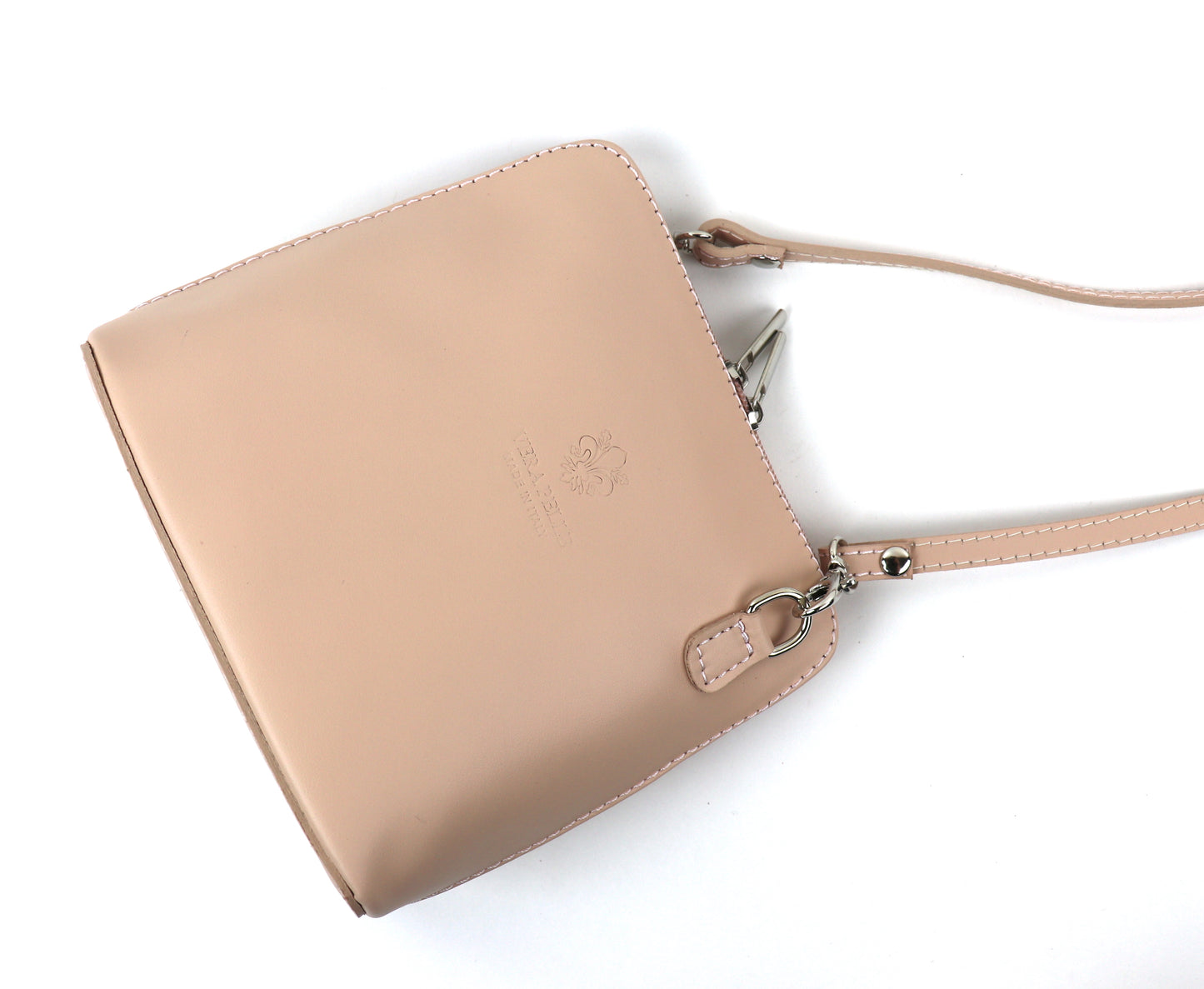 Nude Pink Small Handmade Leather Crossbody Bag, angle view highlighting its soft pastel shade.
