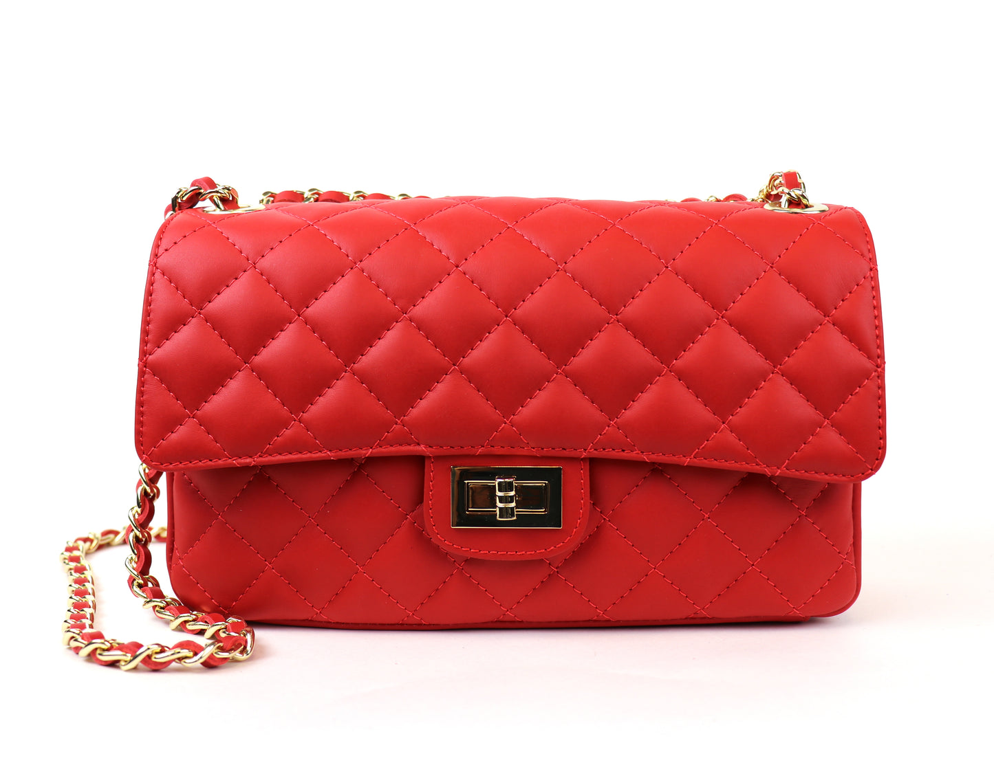 A vibrant red quilted leather bag with a gold chain strap and a lock closure.