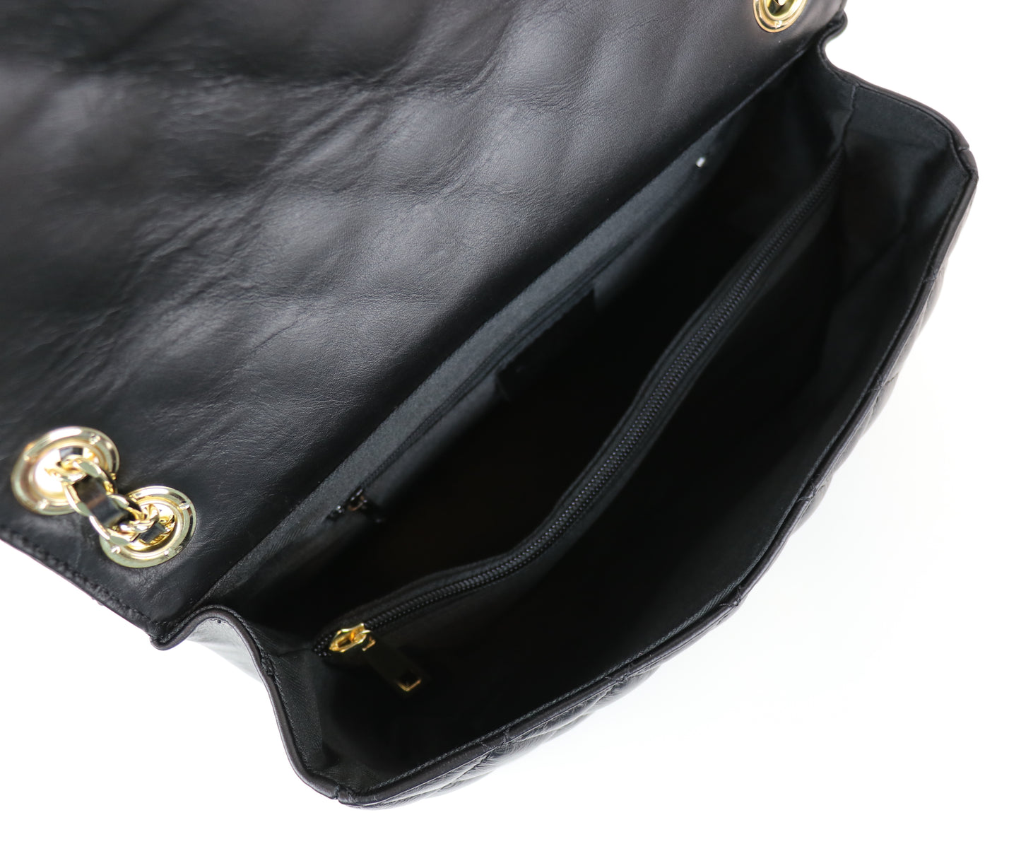 Black Quilted Bag Open: A close-up of the black quilted bag showing the interior with the flap open.