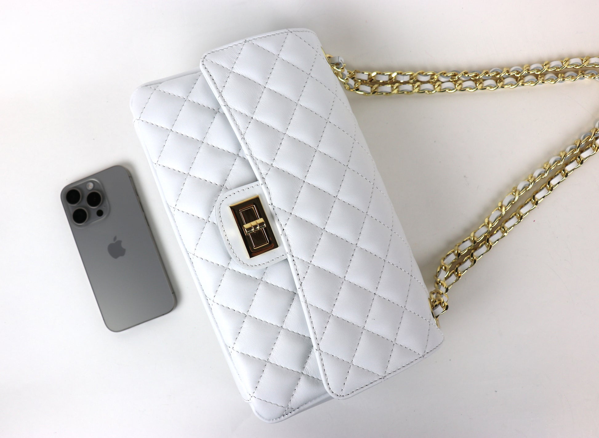 White Quilted Bag with iPhone for Size Reference