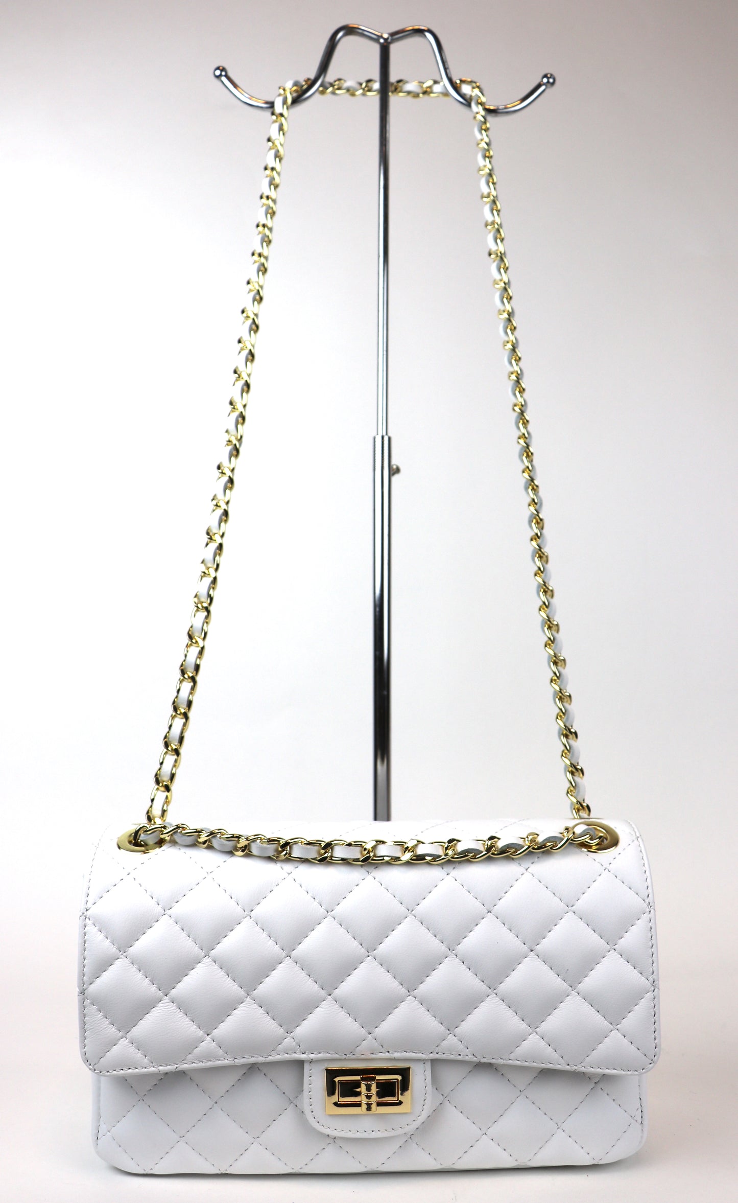 White Quilted Bag on Display Stand