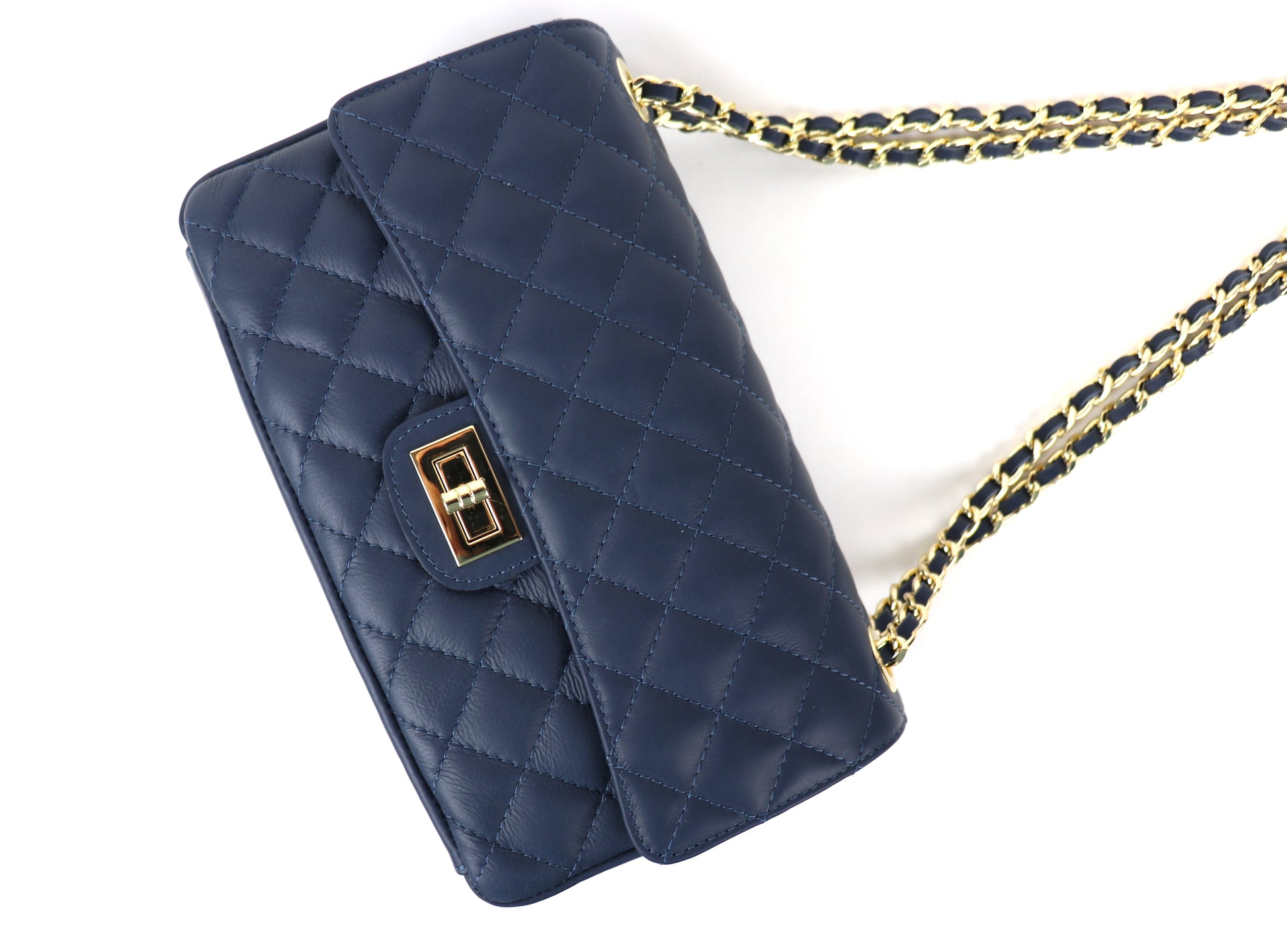 A navy blue quilted leather bag with a gold twist-lock closure and a black-and-gold chain strap, displayed at an angle.