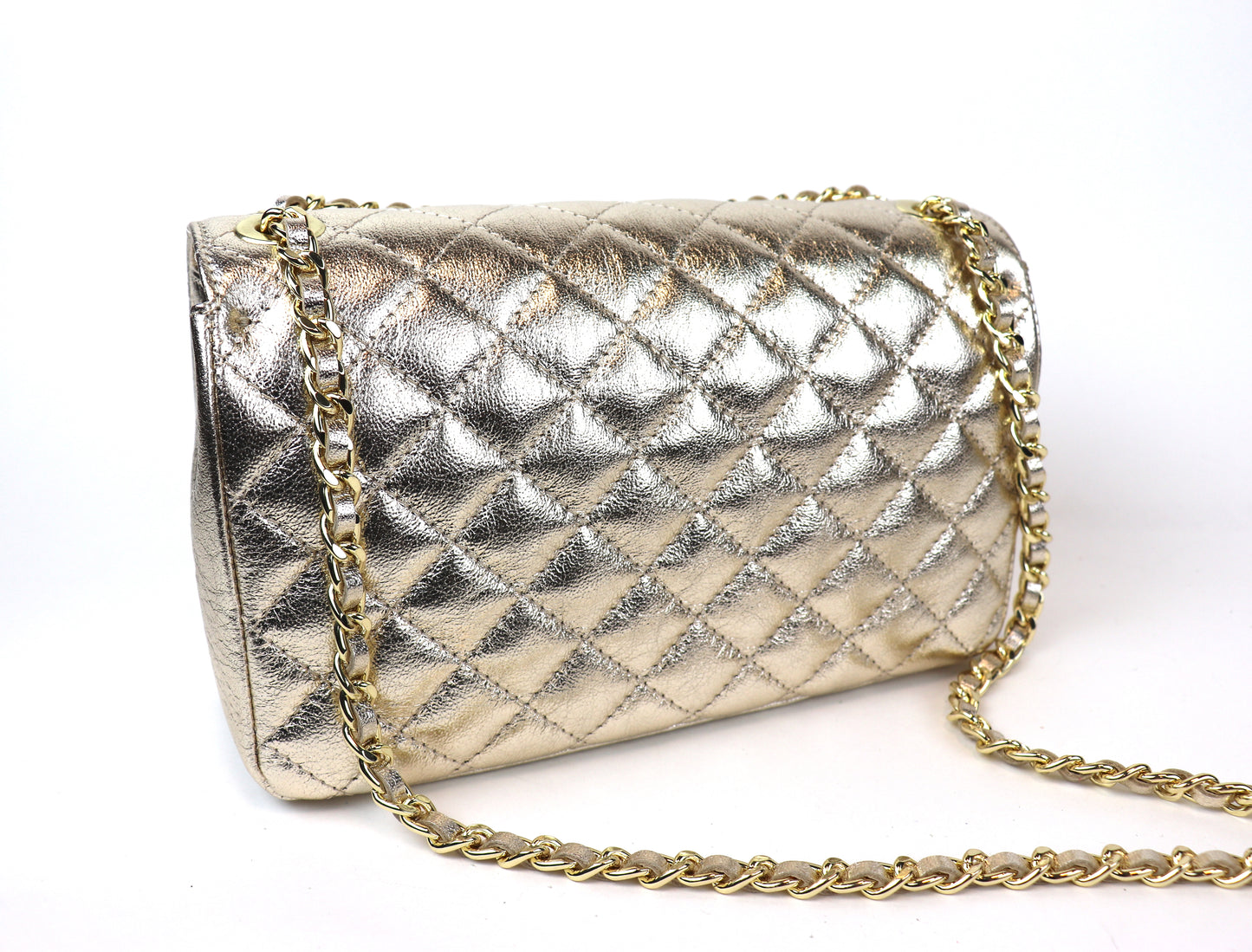 Back view of a gold quilted leather bag with a gold chain strap.