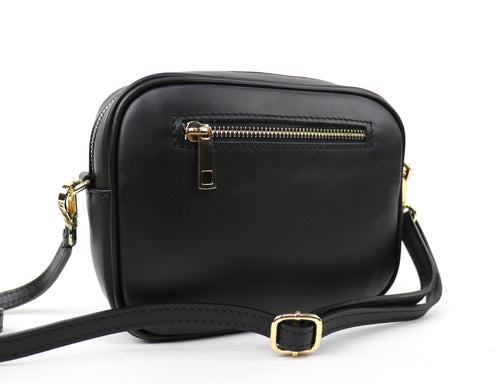 Back view of the Leopard print fur bag, featuring a black leather side with a zip pocket.