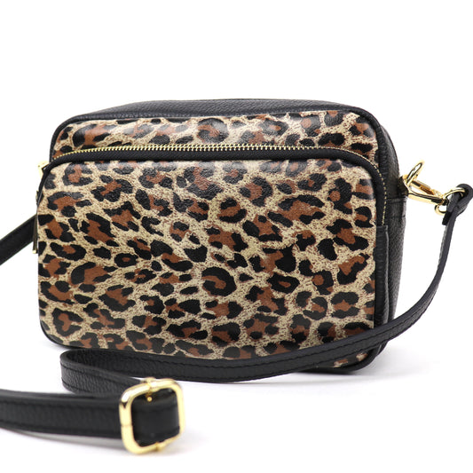 Front view of the Leather Leopard print leather bag, showing the black leather back with a zip pocket.