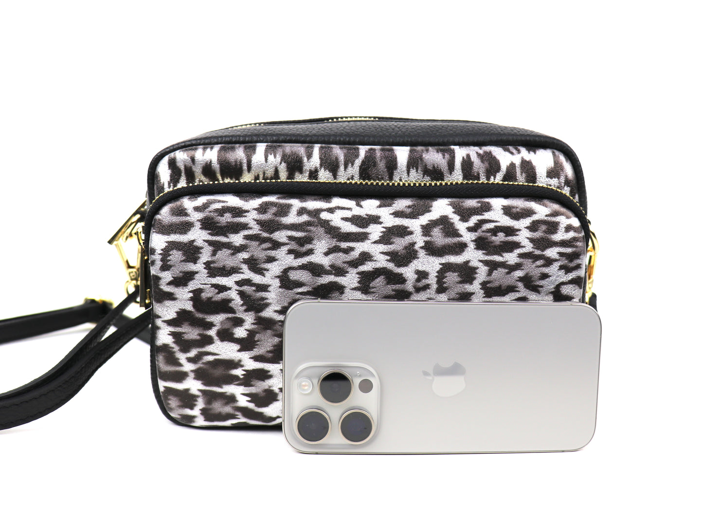 Silver Leopard print leather bag next to a smartphone, highlighting the size of the bag.