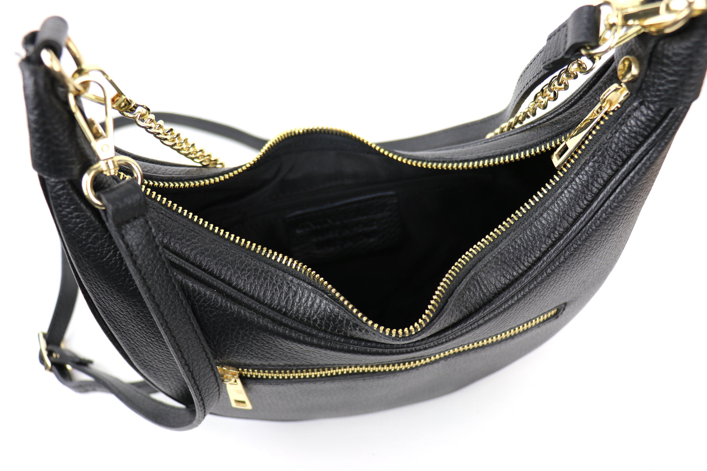 A black leather bag shown from above, with the top zipper open, revealing the interior space.