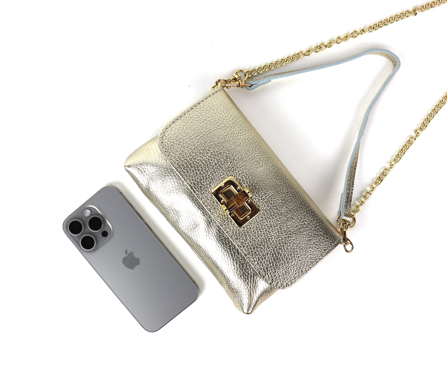 Gold metallic leather bag with a gold clasp and chain, showing the front panel.