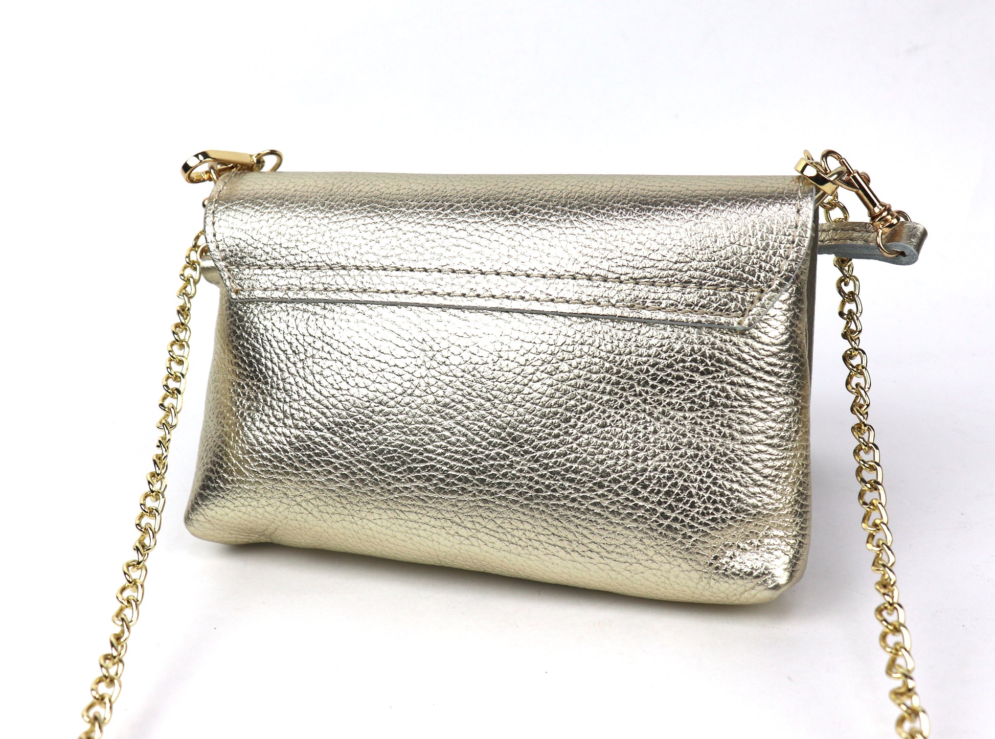 Back view of a gold metallic leather bag, showing the reflective surface and gold chain.