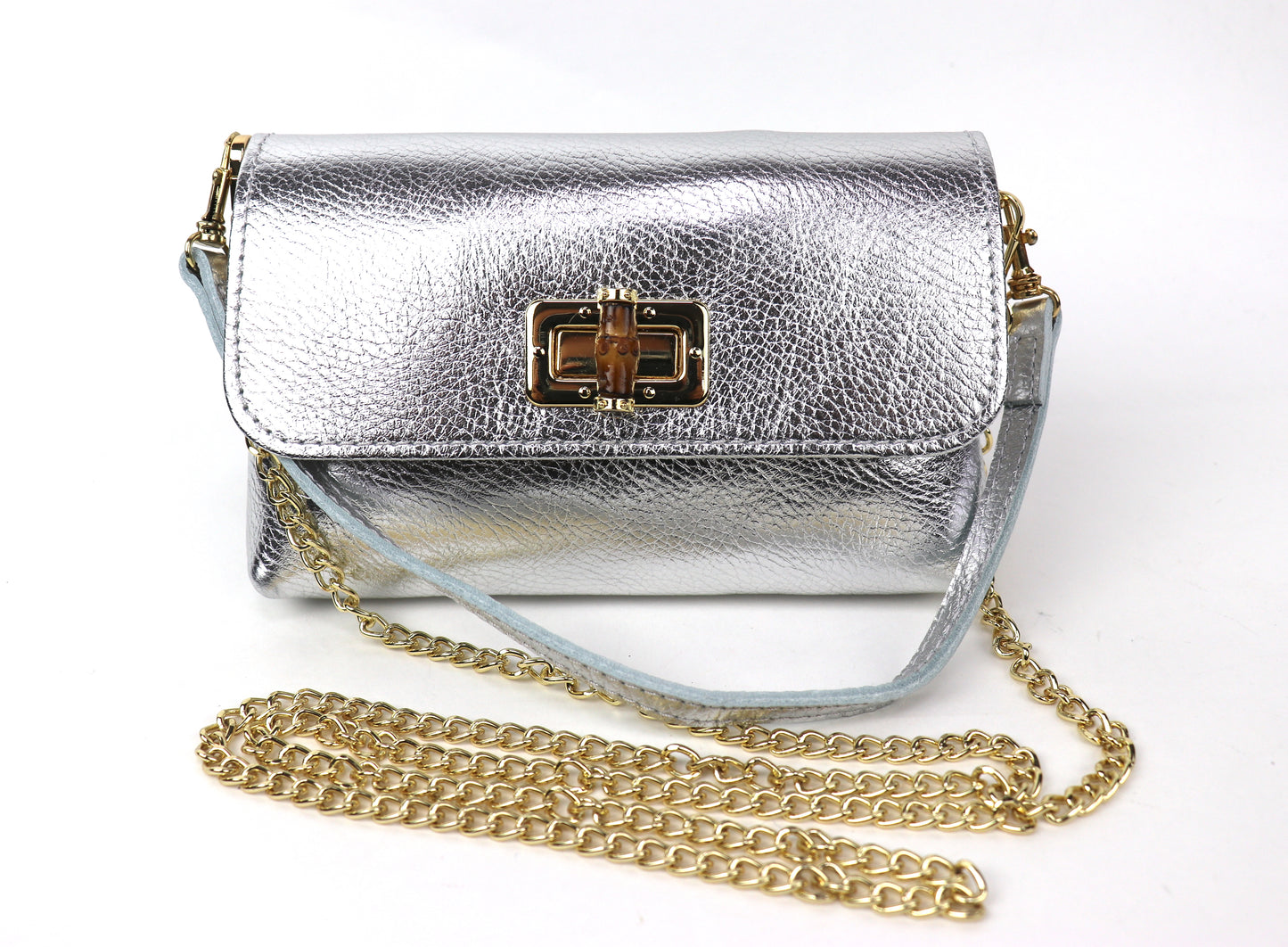 Silver metallic leather bag with a gold clasp and chain, showing the front panel.