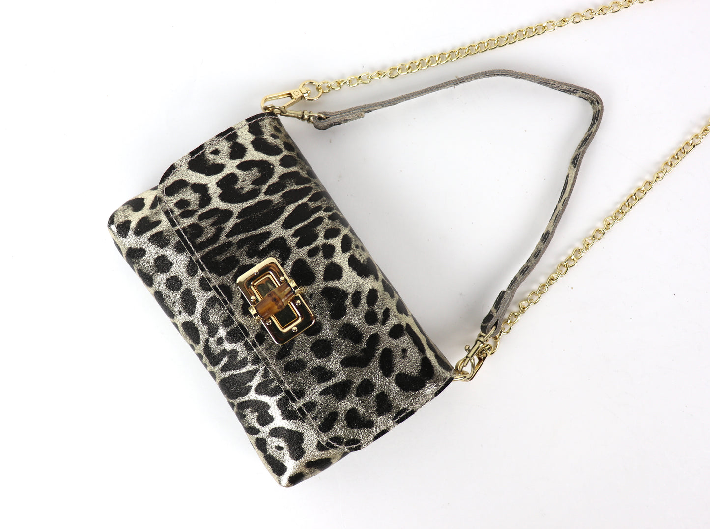 Angled view of a gold leopard print bag, showcasing the bold design and gold accents.