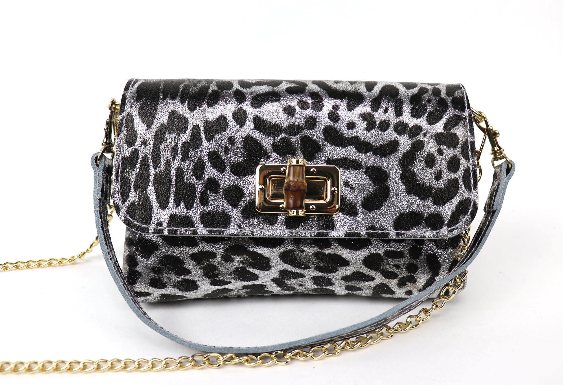 Silver leopard print leather bag with a gold clasp and chain, showing the front panel.