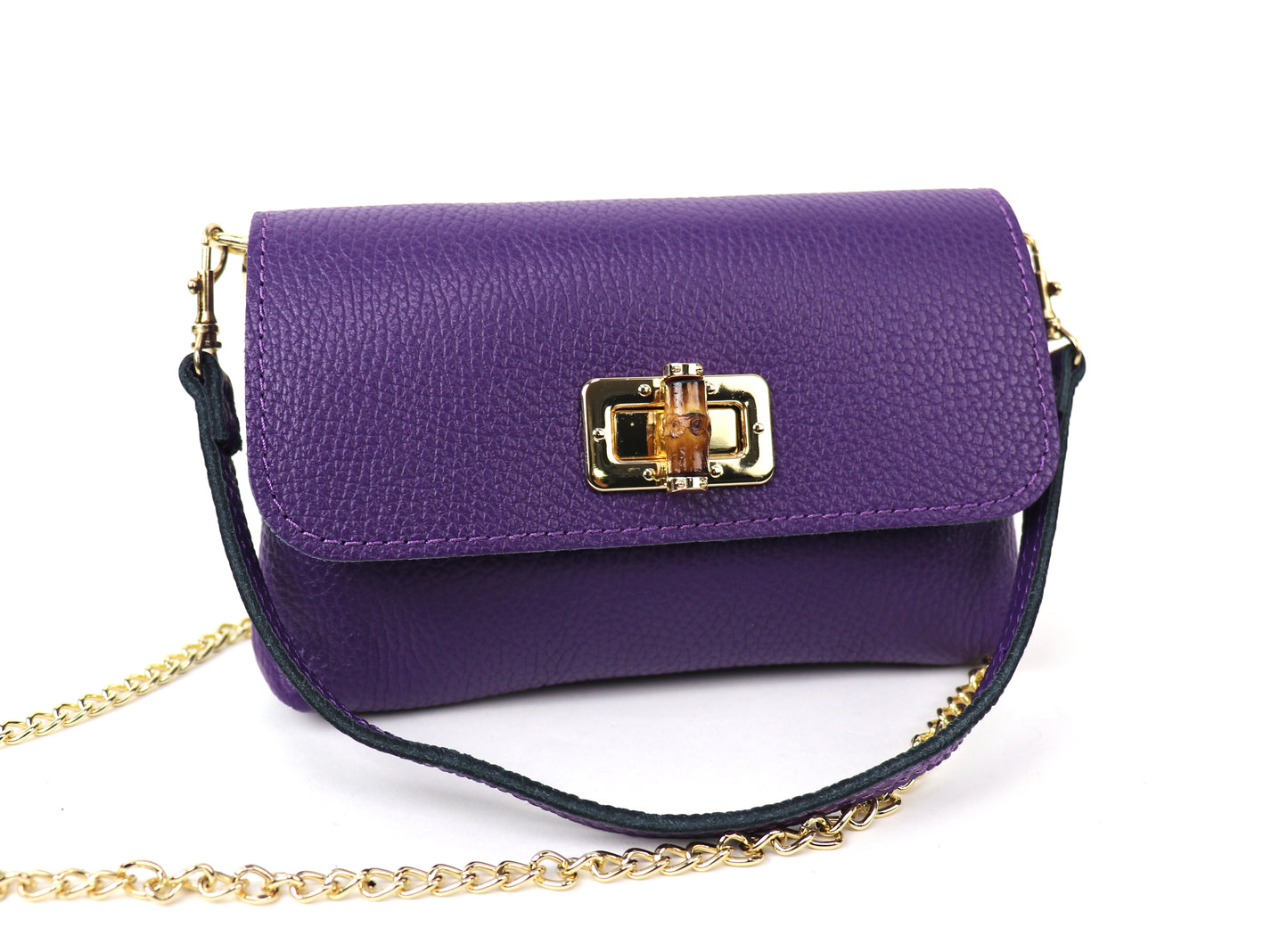 Purple leather bag with a gold clasp and chain, showing the front panel.