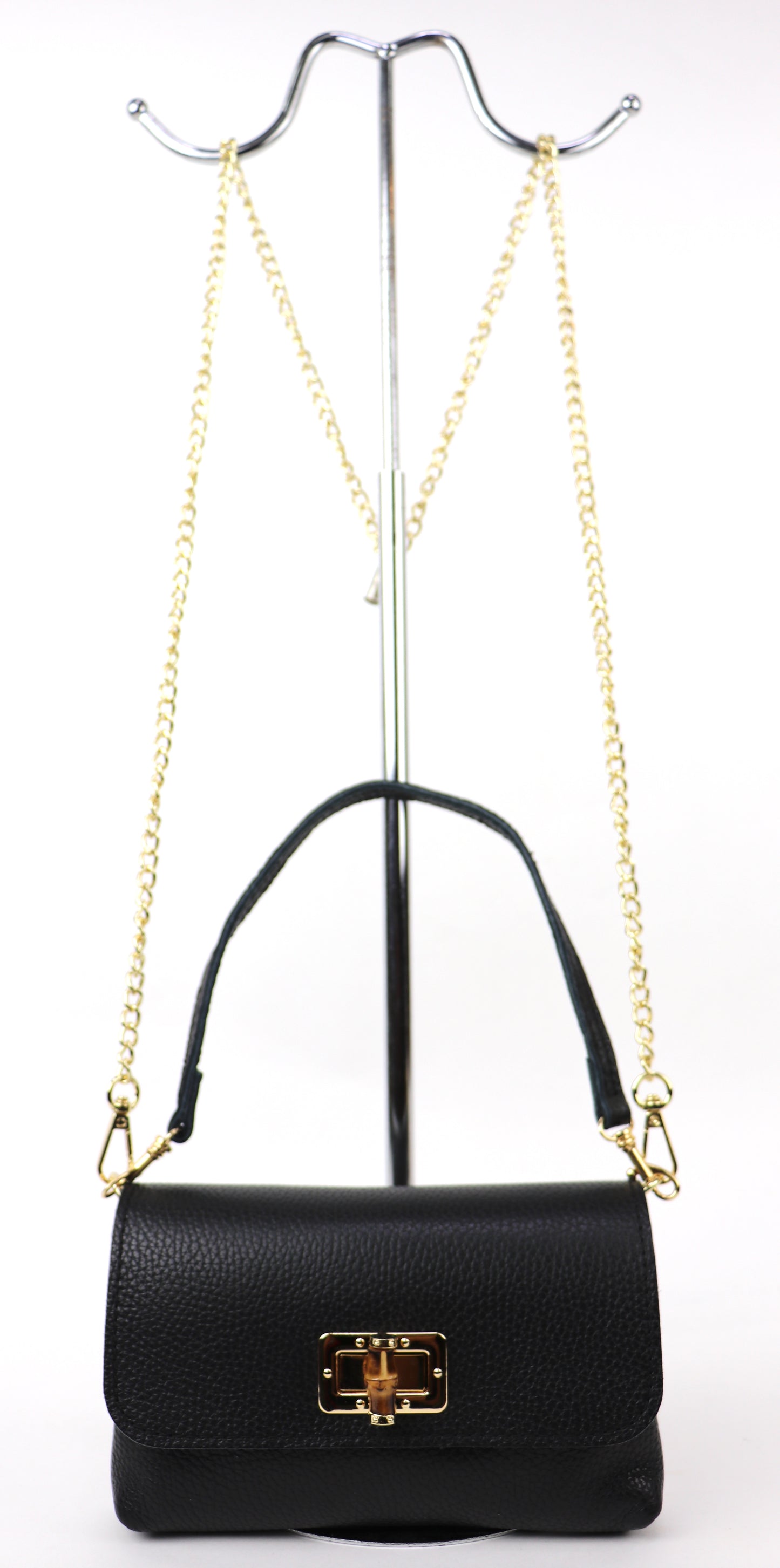 Black Leather Bag: Black leather bag with a gold chain and clasp, displayed hanging.






