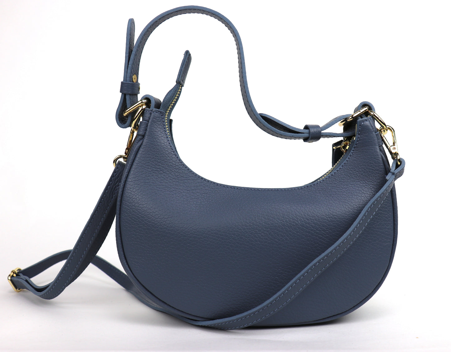 Denim Blue small half moon shoulder/crossbody bag, back view, featuring pebbled leather texture, adjustable strap, and gold-tone hardware.

