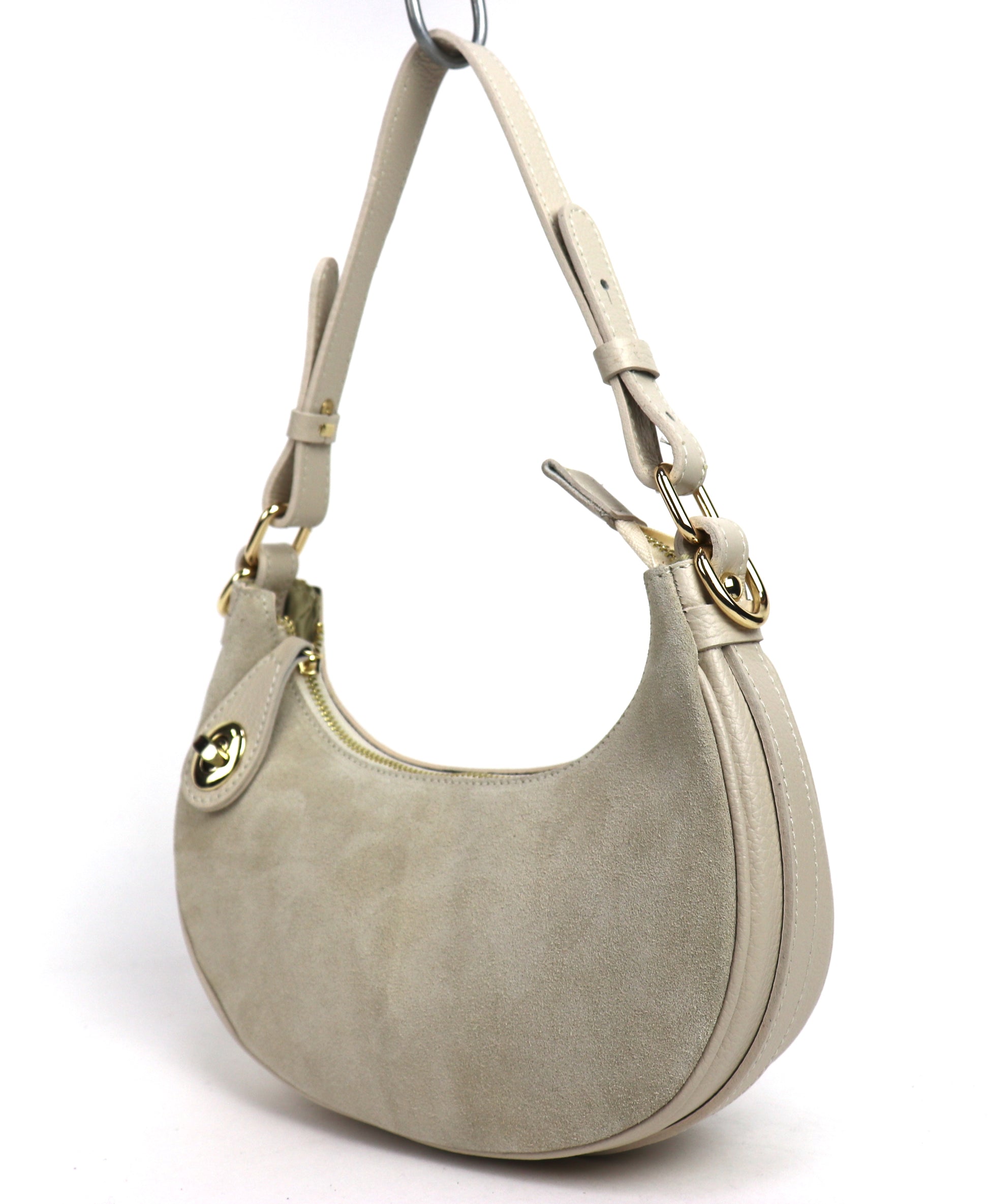 Cream half moon bag angled front view.
