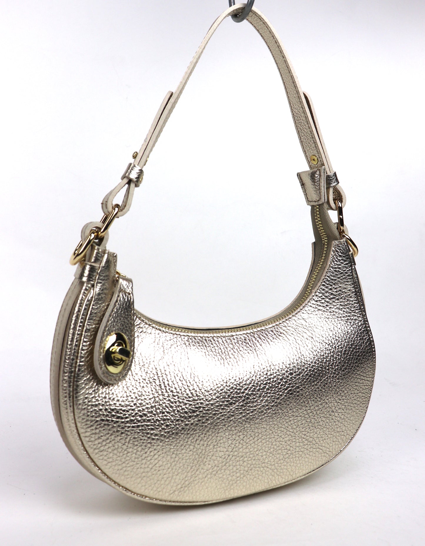 Gold half moon shoulder/crossbody bag, front view.
