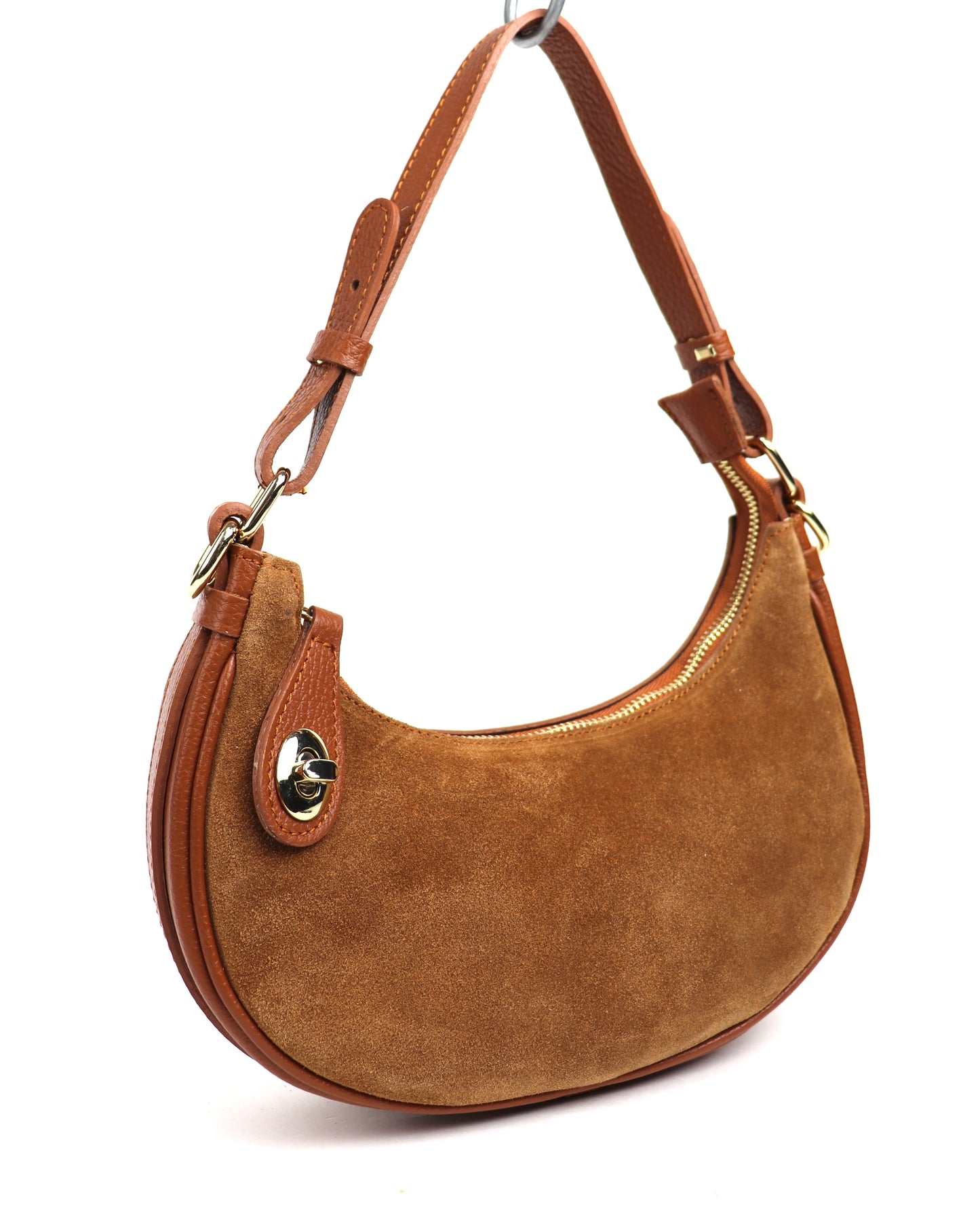 Tan small half moon shoulder/crossbody bag, angled side view, featuring suede texture, leather accents, gold-tone hardware, and adjustable strap displayed against a white background.

