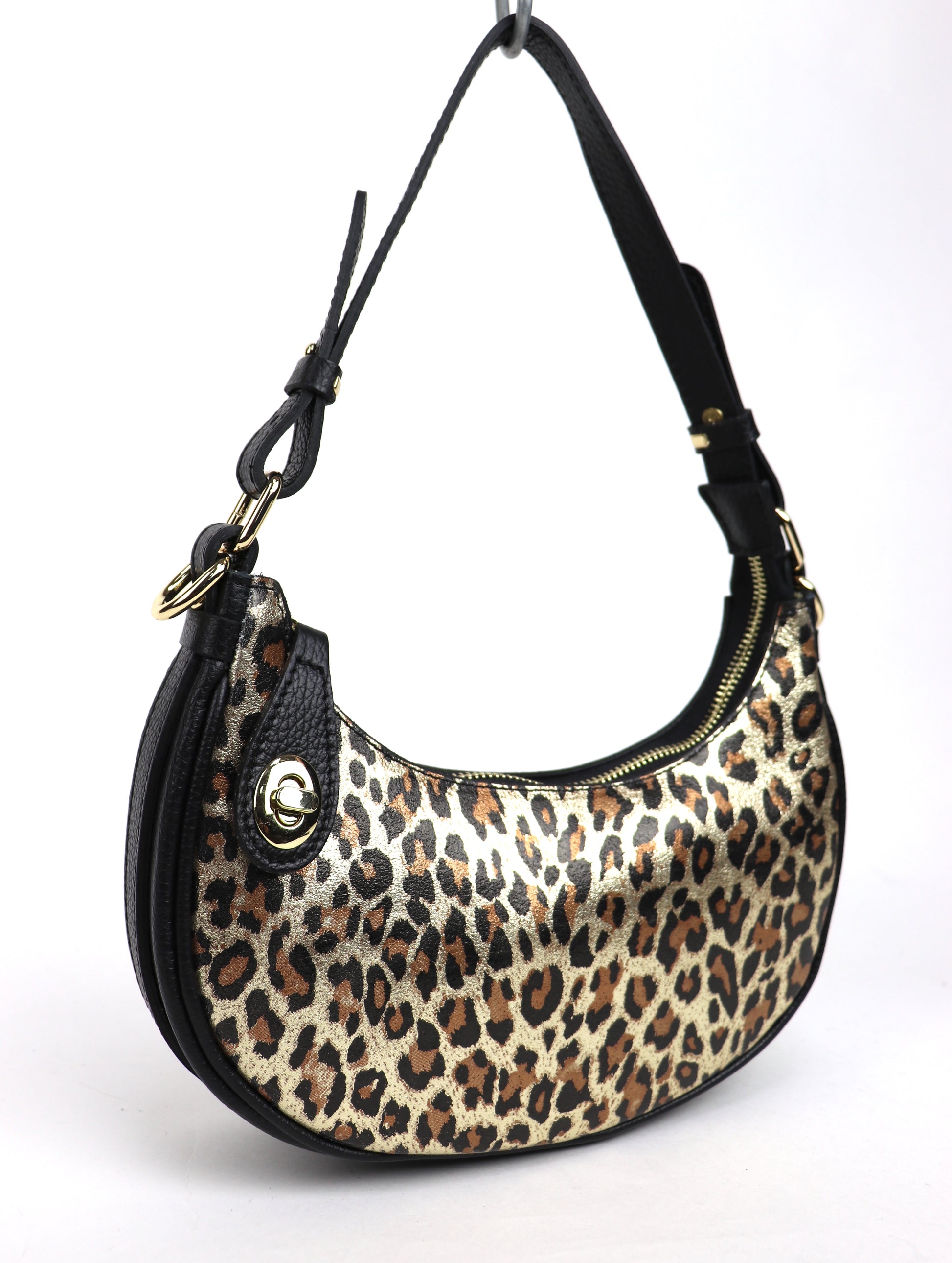 Gold Leopard small half moon shoulder/crossbody bag, angled side view, featuring a bold leopard print, black leather accents, gold-tone hardware, and adjustable strap displayed against a white background.

