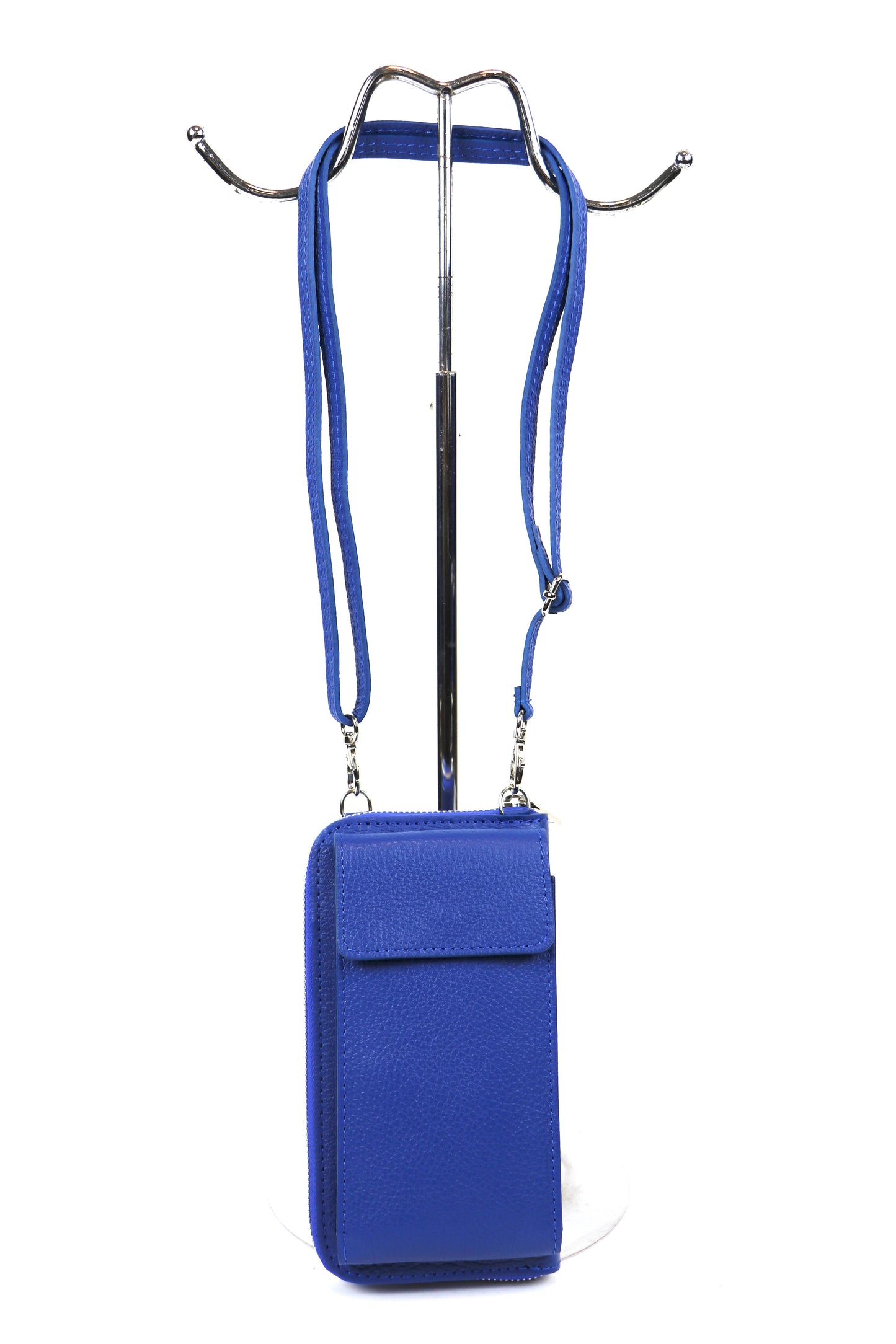 Royal blue Vera Leather Crossbody Bag displayed front-facing on a stand with straps.