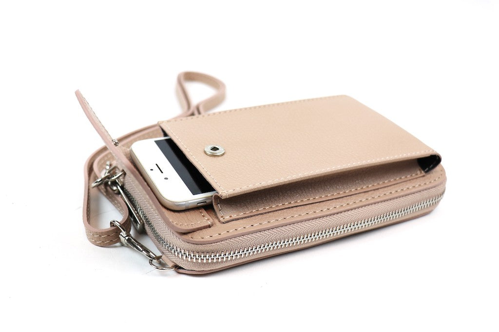 Light Brown crossbody bag with a phone partially inserted in the front flap pocket.