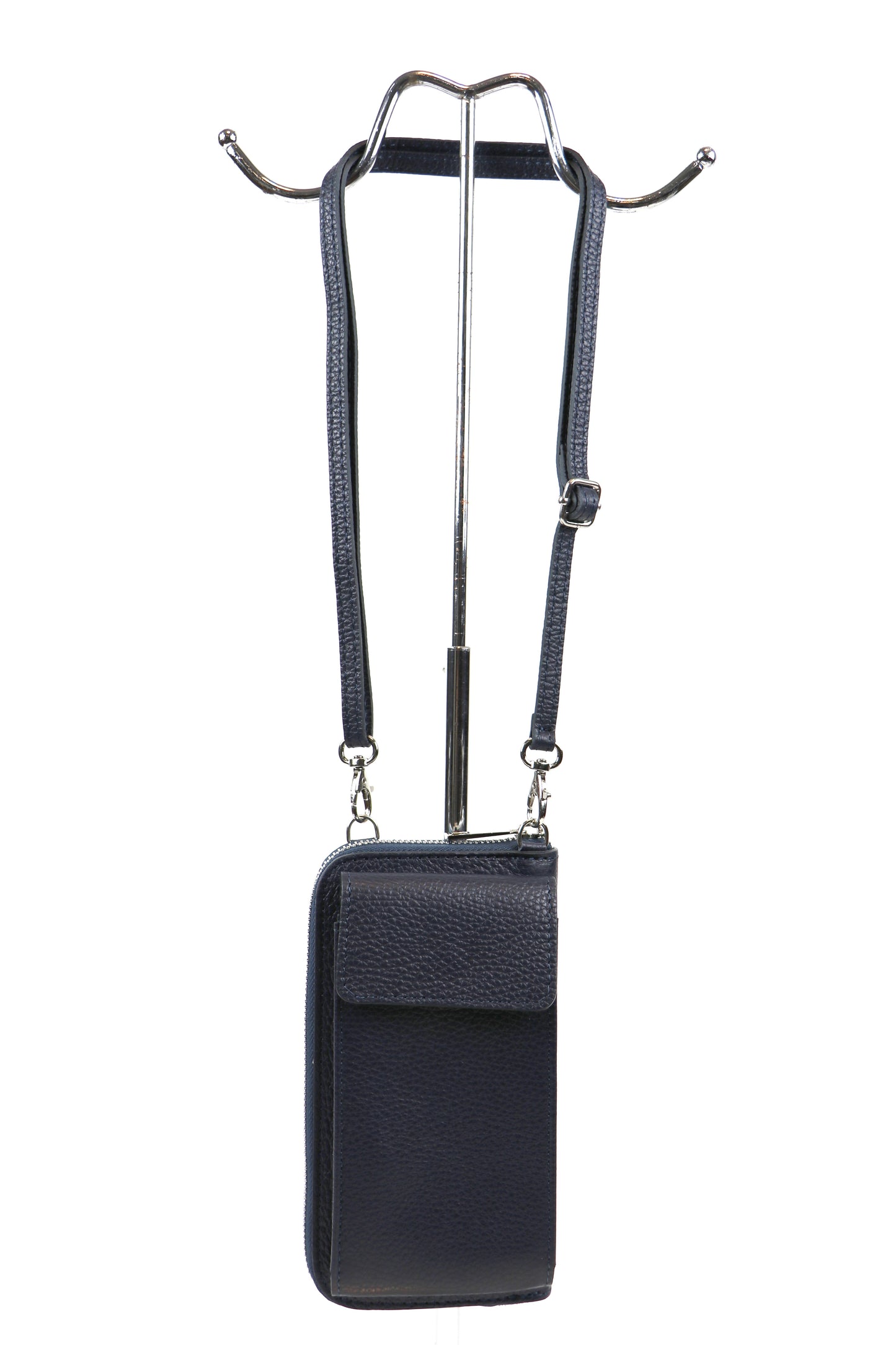 Front view of a navy blue crossbody bag hanging from a stand.