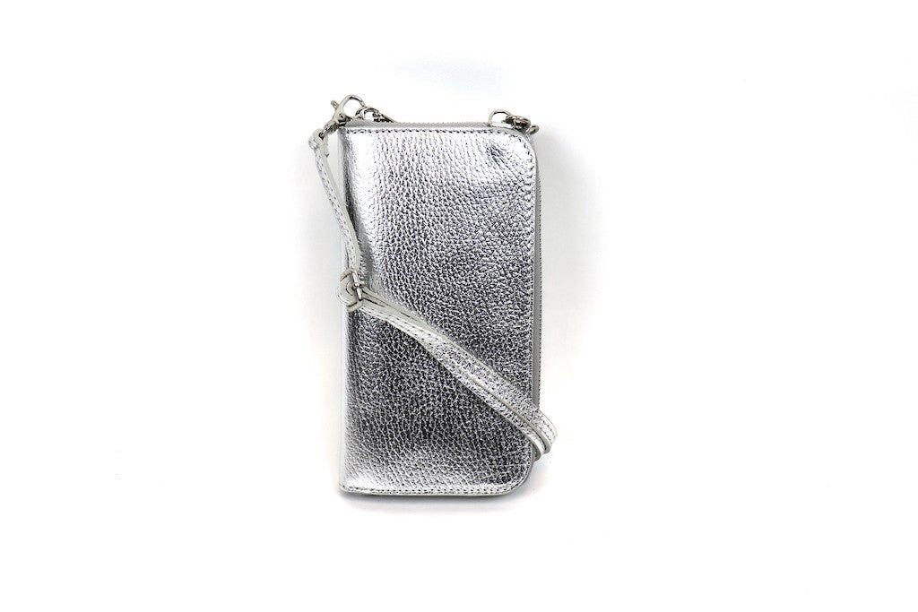 Silver metallic crossbody bag with an adjustable strap and front flap pocket.






