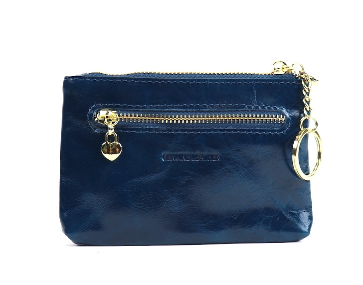 Navy leather pouch with a silver zipper and key ring, angled view.