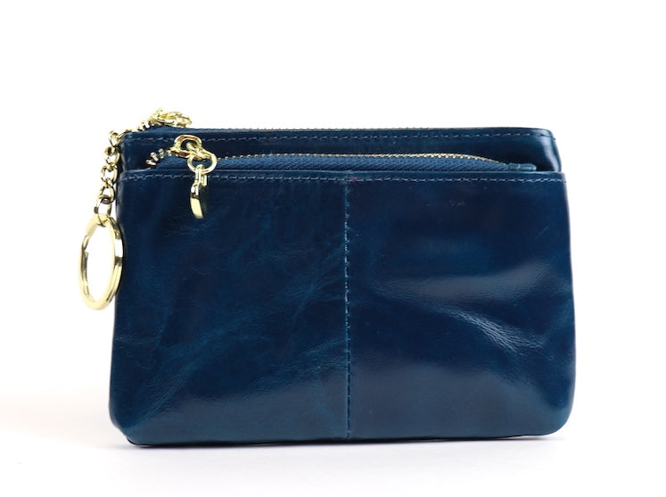 Navy leather pouch with a silver zipper and key ring.