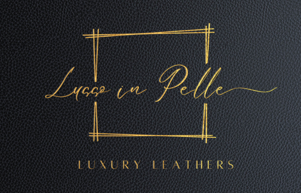 Gold letters that reads "Lusso in Pelle Luxury Leathers" on leather dark navy background