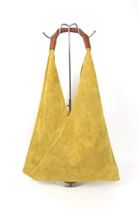 Front view of the Mustard Yellow Samantha Large Tote Laptop Bag displayed on a stand with brown leather handles.